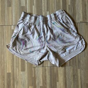 Athleta Mesh Racer Run Short in the "Iridescent Marble Glitch Rainbow"